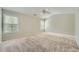 Light-filled bedroom with neutral carpet, vaulted ceiling, and multiple windows at 3765 Clear Lake Nw Way, Acworth, GA 30101