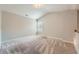Carpeted bedroom featuring neutral walls and natural light from the windows at 3765 Clear Lake Nw Way, Acworth, GA 30101