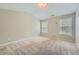 Carpeted bedroom showcasing natural light from the windows and neutral walls at 3765 Clear Lake Nw Way, Acworth, GA 30101