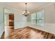 Formal dining room featuring hardwood floors, chandelier, wainscoting and large windows at 3765 Clear Lake Nw Way, Acworth, GA 30101