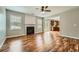 Spacious living room featuring a fireplace, hardwood floors, and an open layout leading to the kitchen and backyard at 3765 Clear Lake Nw Way, Acworth, GA 30101