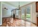 Open-concept room with hardwood floors, fireplace, and doors leading to the backyard, adjacent to the kitchen area at 3765 Clear Lake Nw Way, Acworth, GA 30101