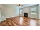 Spacious living room featuring a fireplace, hardwood floors, and a staircase to the upper level at 3765 Clear Lake Nw Way, Acworth, GA 30101