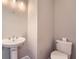 Powder room with pedestal sink and modern toilet at 3765 Clear Lake Nw Way, Acworth, GA 30101