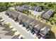 Aerial view of townhomes located at 8335 Village Pl with well-maintained landscaping and attached garages at 8335 Village Pl, Suwanee, GA 30024