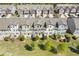Aerial view of the back of the townhomes located at 8335 Village Pl with grassy lawns at 8335 Village Pl, Suwanee, GA 30024