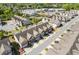 Aerial view of townhomes located at 8335 Village Pl with well-maintained landscaping and attached garages at 8335 Village Pl, Suwanee, GA 30024