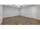 Spacious bedroom with wood floors and closet doors providing lots of storage at 8335 Village Pl, Suwanee, GA 30024