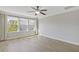 Bright bedroom with hardwood floors, large windows and a ceiling fan at 8335 Village Pl, Suwanee, GA 30024