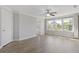 Light-filled bedroom with hardwood floors, multiple windows, and neutral walls at 8335 Village Pl, Suwanee, GA 30024
