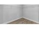 This walk-in closet with vinyl flooring and wire shelving is ready to be customized at 8335 Village Pl, Suwanee, GA 30024