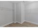 This empty closet with wire shelving and vinyl flooring provides flexible storage options at 8335 Village Pl, Suwanee, GA 30024