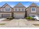 Charming brick townhome with attached garage and well-maintained landscaping at 8335 Village Pl, Suwanee, GA 30024