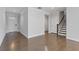 Inviting foyer with hardwood floors and staircase at 8335 Village Pl, Suwanee, GA 30024