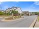 Community entrance with stone pillars, an iron gate, and landscaping at 8335 Village Pl, Suwanee, GA 30024