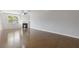 Spacious living room with hardwood floors, fireplace and large window at 8335 Village Pl, Suwanee, GA 30024