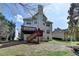 Expansive backyard featuring a spacious wooden deck and lush green surroundings at 2822 Savannah Walk Cv, Suwanee, GA 30024