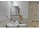 Compact bathroom showcasing a vanity, toilet, and tiled shower at 2822 Savannah Walk Cv, Suwanee, GA 30024