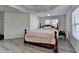 Bedroom features gray wood floors, decorative ceiling, and natural light from the windows at 2822 Savannah Walk Cv, Suwanee, GA 30024
