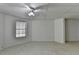 Bedroom featuring tiled floors, natural light from a window, and simple clean finishes at 2822 Savannah Walk Cv, Suwanee, GA 30024