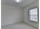Bedroom features tiled flooring, simple design, and a well-lit window at 2822 Savannah Walk Cv, Suwanee, GA 30024