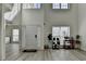 Bright foyer with high ceilings, light wood floors, and an open layout at 2822 Savannah Walk Cv, Suwanee, GA 30024
