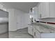 Bright kitchen features granite counters, white cabinets, and stainless steel appliances at 2822 Savannah Walk Cv, Suwanee, GA 30024