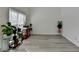 Sunlit living room with tall ceilings, light wood-look floors and lots of space at 2822 Savannah Walk Cv, Suwanee, GA 30024