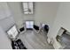 Open living room with hardwood floors, fireplace, and bright windows for natural light at 2822 Savannah Walk Cv, Suwanee, GA 30024