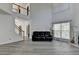 Bright living room featuring high ceilings, a fireplace, and a view of the staircase and upper level at 2822 Savannah Walk Cv, Suwanee, GA 30024