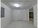 Room showing tiled floors, a doorway, and an electrical panel, offering a blank canvas at 2822 Savannah Walk Cv, Suwanee, GA 30024