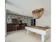 Finished basement with a stylish bar area, unique lighting, and a pool table for entertaining at 3011 Cravey Trl, Tucker, GA 30345