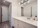 Bright bathroom featuring a large vanity with modern fixtures and ample storage space at 3011 Cravey Trl, Tucker, GA 30345