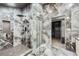 Luxurious bathroom features marble accents, modern glass shower, and a connected walk in closet at 3011 Cravey Trl, Tucker, GA 30345