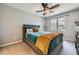 Inviting bedroom features plush carpet, a comfortable bed, large window and neutral decor at 3011 Cravey Trl, Tucker, GA 30345