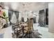 Open dining room with a chandelier, animal print chairs, and an eye-catching accent wall at 3011 Cravey Trl, Tucker, GA 30345