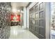 Stunning foyer with textured wall, double doors, and a glimpse of the dining area beyond at 3011 Cravey Trl, Tucker, GA 30345