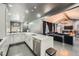 Modern kitchen with white cabinets, quartz countertops, stainless steel appliances, and an open design at 3011 Cravey Trl, Tucker, GA 30345