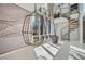 Unique living room features white epoxy floors, high ceilings, a decorative staircase, and a stylish hanging chair at 3011 Cravey Trl, Tucker, GA 30345
