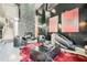 Stylish living room with a geometric fireplace, modern furniture, and a red hide rug at 3011 Cravey Trl, Tucker, GA 30345