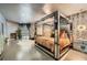 Luxurious bedroom with mirrored canopy bed, decorative fireplace, and access to outdoor patio at 3011 Cravey Trl, Tucker, GA 30345