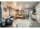 Large bedroom with decor wallpaper, seating area, mirrored canopy bed, and modern accents at 3011 Cravey Trl, Tucker, GA 30345