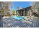 Stunning backyard pool and deck, perfect for entertaining at this modern two-story home with large windows at 3011 Cravey Trl, Tucker, GA 30345