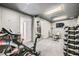 Home gym equipped with exercise equipment, a punching bag, and wall-mounted storage at 3011 Cravey Trl, Tucker, GA 30345