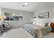 Calm bedroom with a ceiling fan, a large window, neutral colors, and cozy decor at 3085 Balearic Se Dr, Marietta, GA 30067