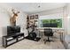 Bedroom featuring a Peloton bike, home office, and window with lots of natural light at 3085 Balearic Se Dr, Marietta, GA 30067