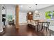 Open-concept dining area with hardwood floors, modern lighting, and stylish decor at 3085 Balearic Se Dr, Marietta, GA 30067