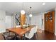 Dining room with hardwood floors, natural light, and contemporary light fixtures at 3085 Balearic Se Dr, Marietta, GA 30067