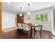 Dining room with hardwood floors, natural light, and contemporary light fixtures at 3085 Balearic Se Dr, Marietta, GA 30067