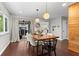 Dining room features hardwood floors, stylish lighting, and sliding door access to an outdoor area at 3085 Balearic Se Dr, Marietta, GA 30067